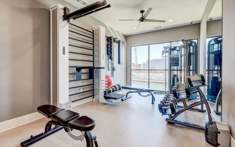 a room with a chair and a table with a gun in it